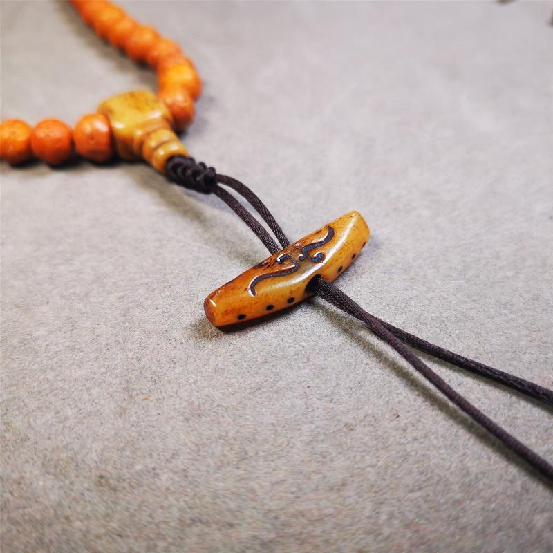 This unique bone carved ruyi pendant is made by Tibetan craftsmen in Hepo Township, Baiyu County, the birthplace of the famous Tibetan handicrafts. You can use it as a spacer bead on mala,or pendant bead under guru bead. Also can be use as amulet pendant or keychain.