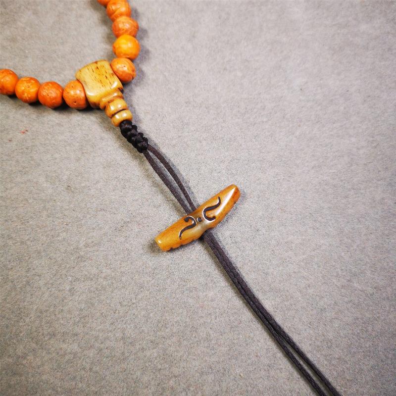 This unique bone carved ruyi pendant is made by Tibetan craftsmen in Hepo Township, Baiyu County, the birthplace of the famous Tibetan handicrafts. You can use it as a spacer bead on mala,or pendant bead under guru bead. Also can be use as amulet pendant or keychain.
