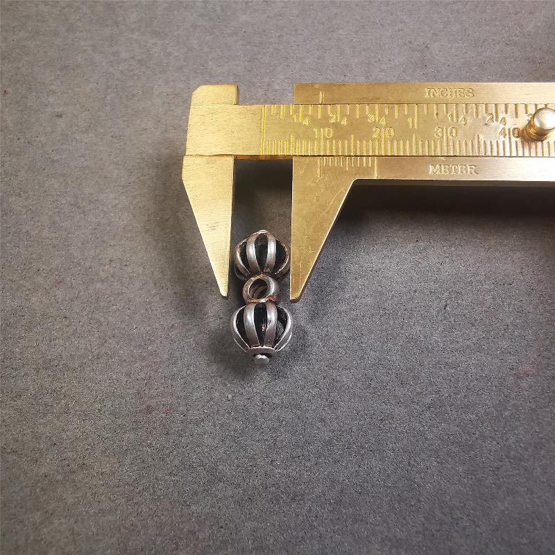 This unique sterling silver vajra pendant was made by Tibetan craftsmen in Hepo Township, Baiyu County, the birthplace of the famous Tibetan handicrafts. You can use it as a spacer bead on mala,or pendant bead under guru bead. Also can be use as amulet pendant or keychain.