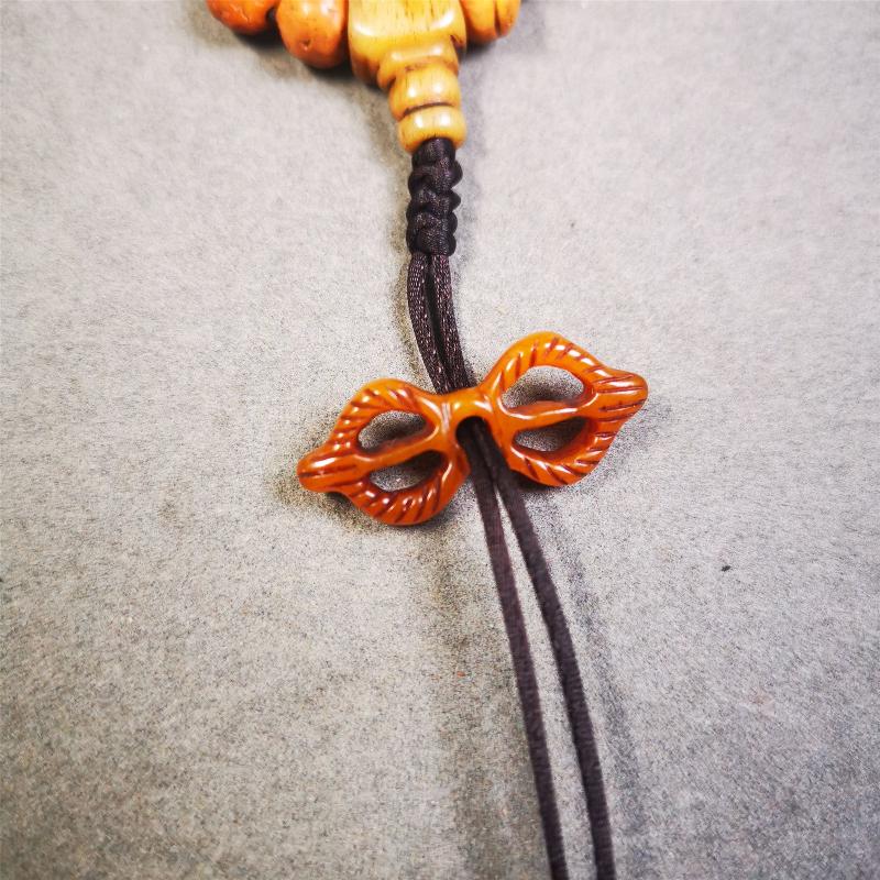 This unique bone carved vajra pendant is made by Tibetan craftsmen in Hepo Township, Baiyu County, the birthplace of the famous Tibetan handicrafts. You can make it as a mala pendant below the guru bead, or spacer bead on mala. Also can be use as pendant or keychain.