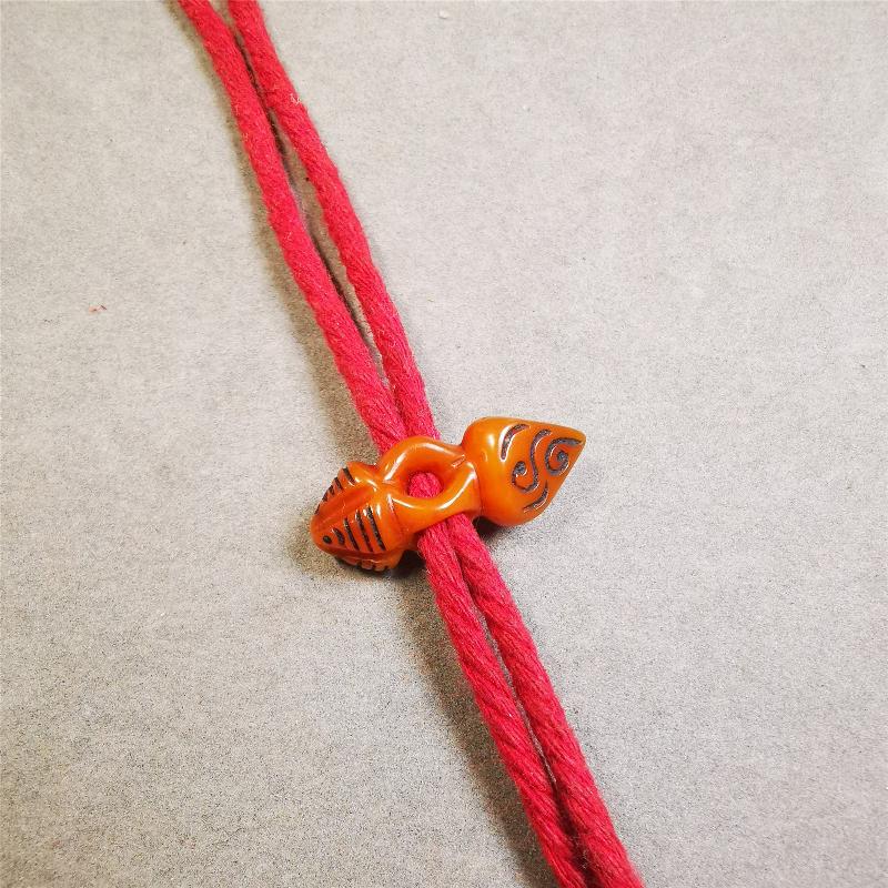 This unique bone carved phurba pendant is made by Tibetan craftsmen in Hepo Township, Baiyu County, the birthplace of the famous Tibetan handicrafts. You can use it as a spacer bead on mala,or pendant bead under guru bead. Also can be use as amulet pendant or keychain.