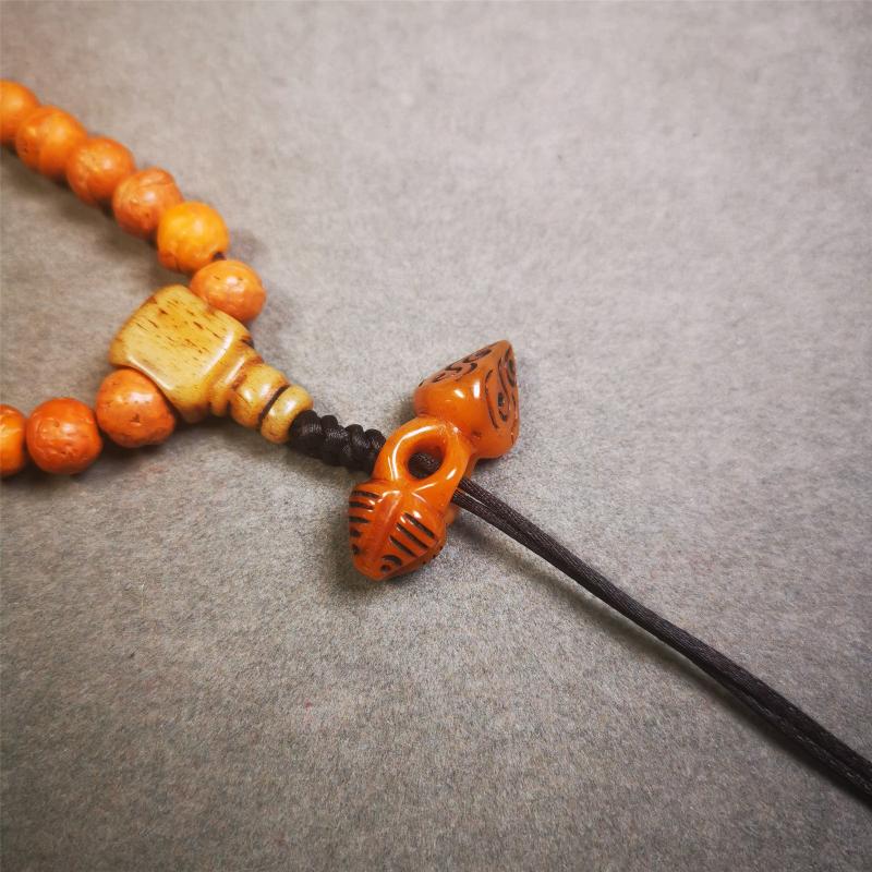 This unique bone carved phurba pendant is made by Tibetan craftsmen in Hepo Township, Baiyu County, the birthplace of the famous Tibetan handicrafts. You can use it as a spacer bead on mala,or pendant bead under guru bead. Also can be use as amulet pendant or keychain.
