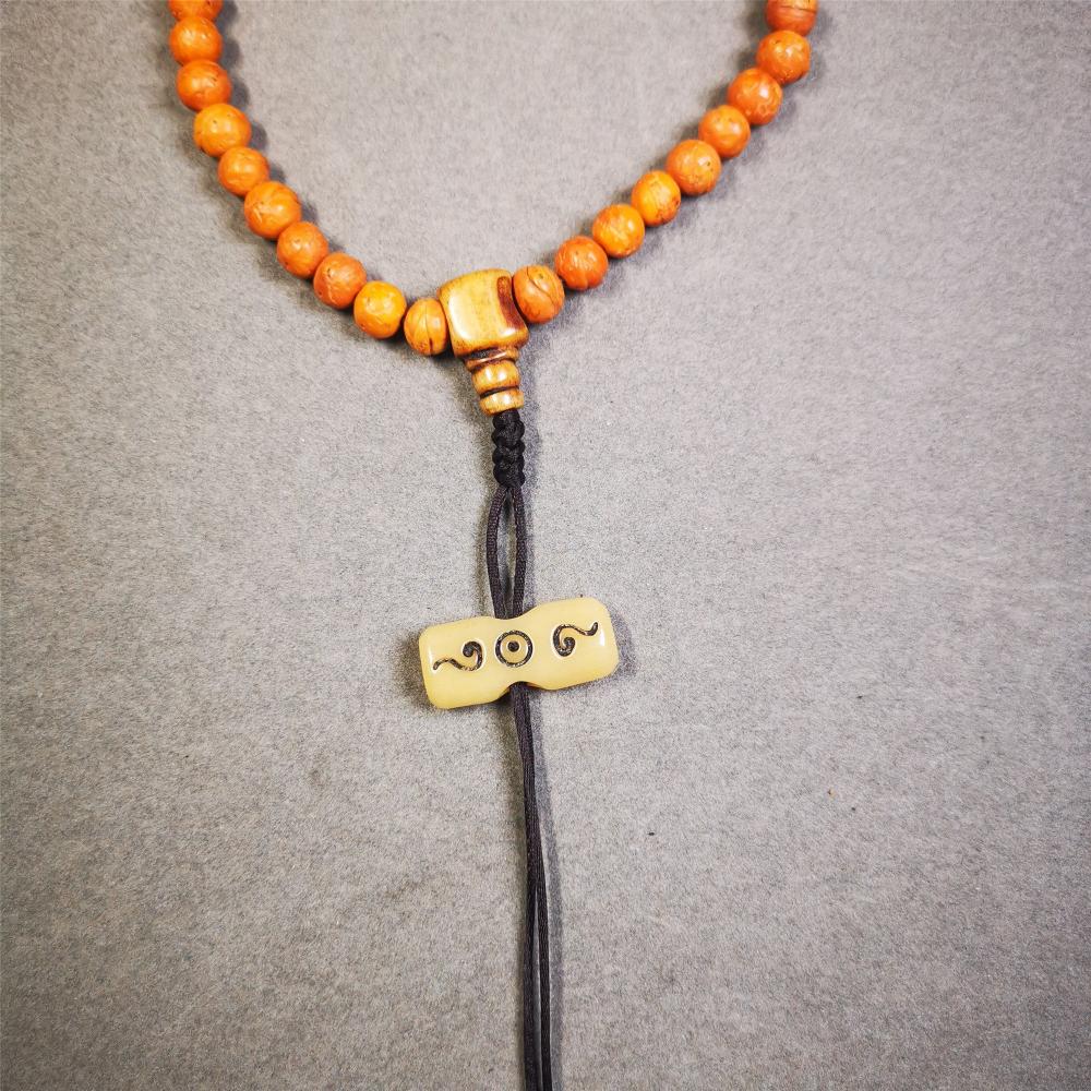 This unique bone carved ruyi pendant is made by Tibetan craftsmen in Hepo Township, Baiyu County, the birthplace of the famous Tibetan handicrafts. You can use it as a spacer bead on mala,or pendant bead under guru bead. Also can be use as amulet pendant or keychain.