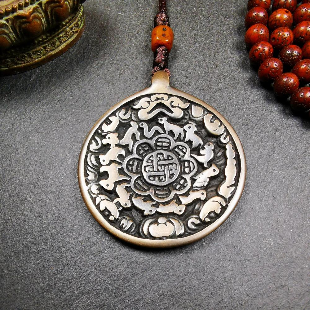 This unique tibetan melong badge was collected from Baiyu Monastery for 30 years. It's a Astrology Protective Amulet Pendant,made of cold iron. The pattern is Tibetan Budhist Protective Amulet Pendant - SIPAHO(srid pa ho).