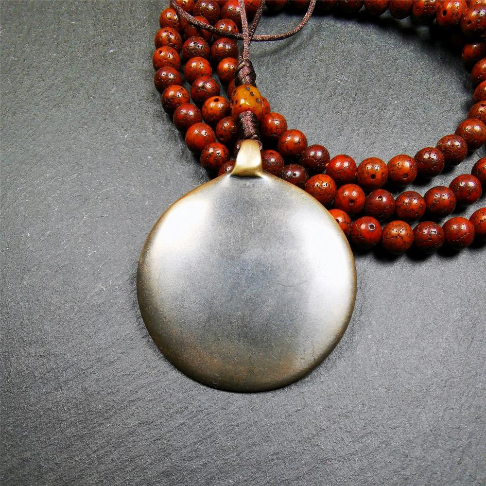 This unique tibetan melong badge was collected from Baiyu Monastery for 30 years. It's a Astrology Protective Amulet Pendant,made of cold iron. The pattern is Tibetan Budhist Protective Amulet Pendant - SIPAHO(srid pa ho).