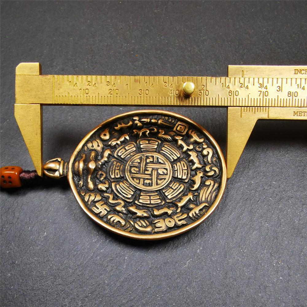 This unique tibetan melong badge was handmade by Tibetan Artist from Baiyu County. It's a Astrology Protective Amulet Pendant,made of brass,the front pattern is Tibetan Budhist Protective Amulet Pendant - SIPAHO(srid pa ho),a bone carved dice bead in the middle of the lanyard.