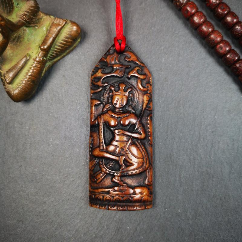 This bone carved Troma Nagmo amulet was collected from Gerze Tibet, hand carved by Tibetan Craft man,about 30 years old. Troma Nagmo literally means the Black Wrathful Lady. She is included in the Dharmapala pantheon as a form of Vajravarahi.