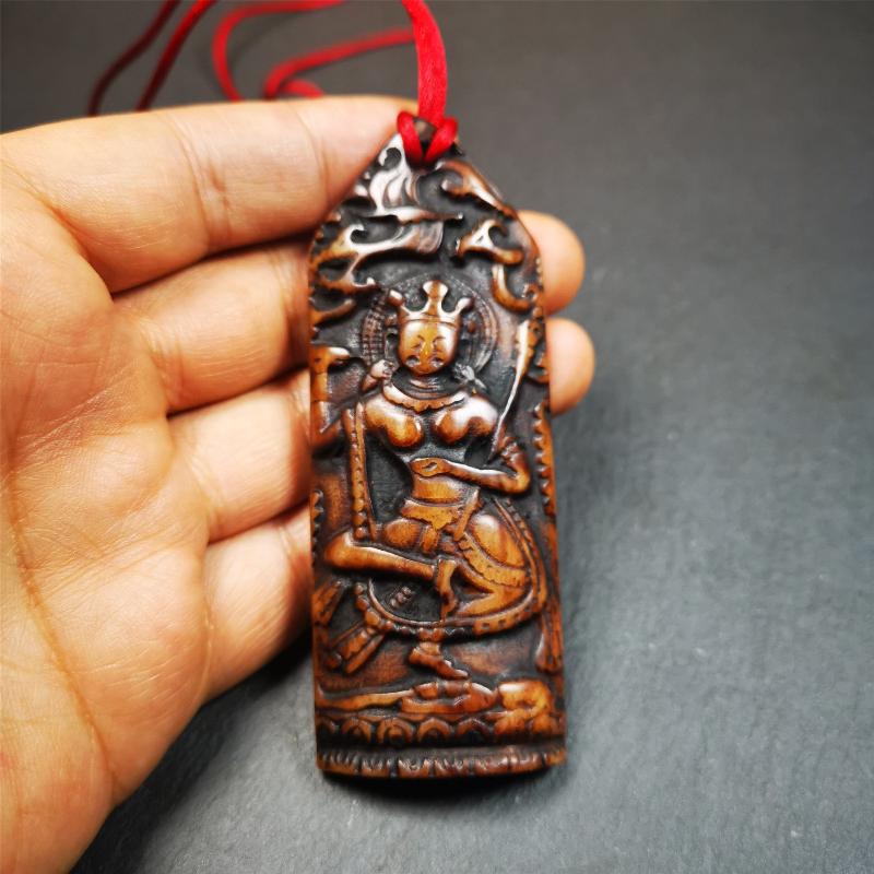 This bone carved Troma Nagmo amulet was collected from Gerze Tibet, hand carved by Tibetan Craft man,about 30 years old. Troma Nagmo literally means the Black Wrathful Lady. She is included in the Dharmapala pantheon as a form of Vajravarahi.
