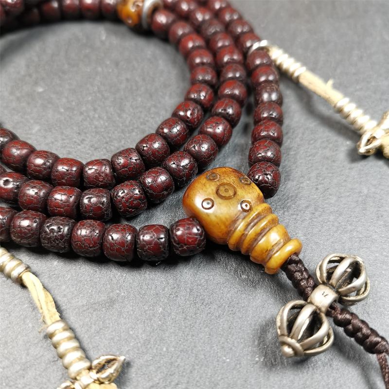 This mala is made by Tibetan craftsmen and come from Hepo Town, Baiyu County,Tibet, the birthplace of the famous Tibetan handicrafts,about 30 years old,blessed by a lama in Baiyu Monastery. It's composed of 108 pcs 8mm lotus seed beads,then add some old bone beads,1 pair of silver bead counters,and silver guru bead,vajra pandent