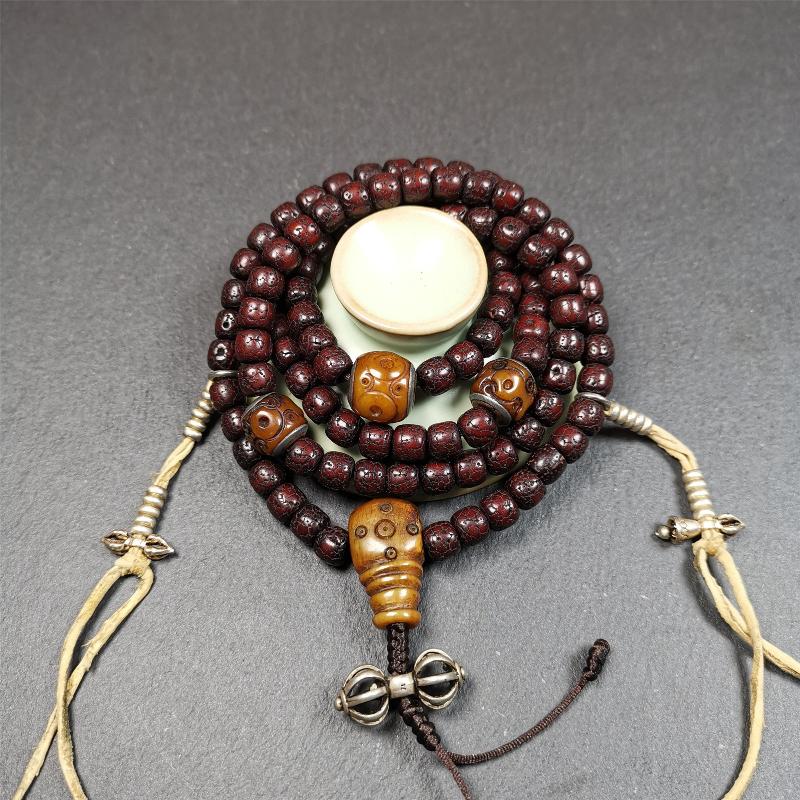 This mala is made by Tibetan craftsmen and come from Hepo Town, Baiyu County,Tibet, the birthplace of the famous Tibetan handicrafts,about 30 years old,blessed by a lama in Baiyu Monastery. It's composed of 108 pcs 8mm lotus seed beads,then add some old bone beads,1 pair of silver bead counters,and silver guru bead,vajra pandent