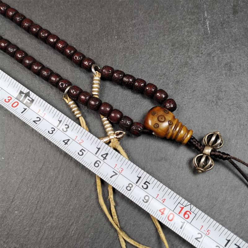 This mala is made by Tibetan craftsmen and come from Hepo Town, Baiyu County,Tibet, the birthplace of the famous Tibetan handicrafts,about 30 years old,blessed by a lama in Baiyu Monastery. It's composed of 108 pcs 8mm lotus seed beads,then add some old bone beads,1 pair of silver bead counters,and silver guru bead,vajra pandent