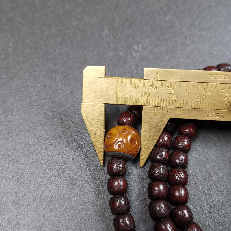 This mala is made by Tibetan craftsmen and come from Hepo Town, Baiyu County,Tibet, the birthplace of the famous Tibetan handicrafts,about 30 years old,blessed by a lama in Baiyu Monastery. It's composed of 108 pcs 8mm lotus seed beads,then add some old bone beads,1 pair of silver bead counters,and silver guru bead,vajra pandent