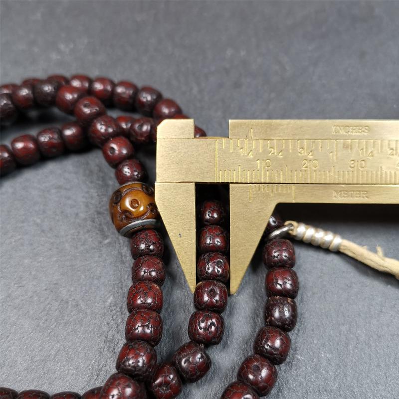 This mala is made by Tibetan craftsmen and come from Hepo Town, Baiyu County,Tibet, the birthplace of the famous Tibetan handicrafts,about 30 years old,blessed by a lama in Baiyu Monastery. It's composed of 108 pcs 8mm lotus seed beads,then add some old bone beads,1 pair of silver bead counters,and silver guru bead,vajra pandent