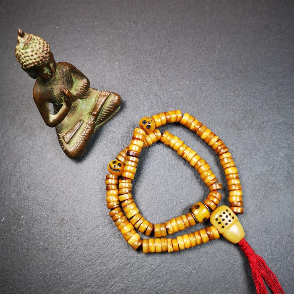 This yak bone mala was handmade from tibetan crafts man in Baiyu County,about 30 years old. It's composed of 108 pcs 9mm bone beads,with bone carved beads,guru bead.