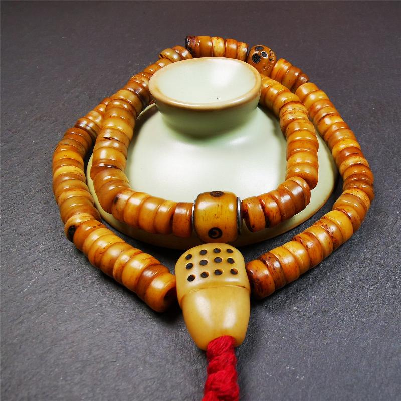 This yak bone mala was handmade from tibetan crafts man in Baiyu County,about 30 years old. It's composed of 108 pcs 9mm bone beads,with bone carved beads,guru bead.