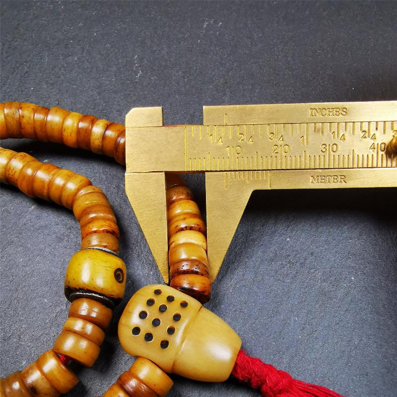 This yak bone mala was handmade from tibetan crafts man in Baiyu County,about 30 years old. It's composed of 108 pcs 9mm bone beads,with bone carved beads,guru bead.