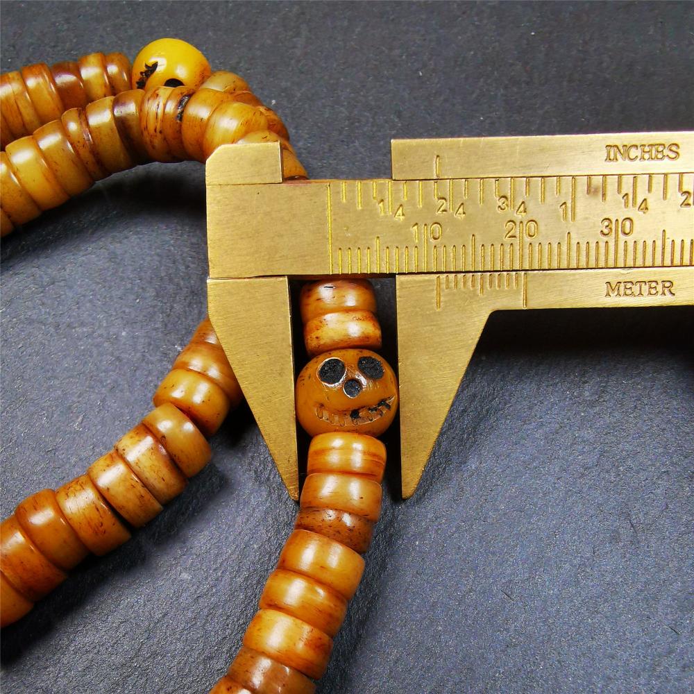 This yak bone mala was handmade from tibetan crafts man in Baiyu County,about 30 years old. It's composed of 108 pcs 9mm bone beads,with bone carved beads,guru bead.