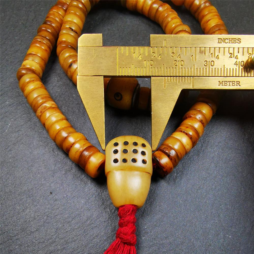 This yak bone mala was handmade from tibetan crafts man in Baiyu County,about 30 years old. It's composed of 108 pcs 9mm bone beads,with bone carved beads,guru bead.