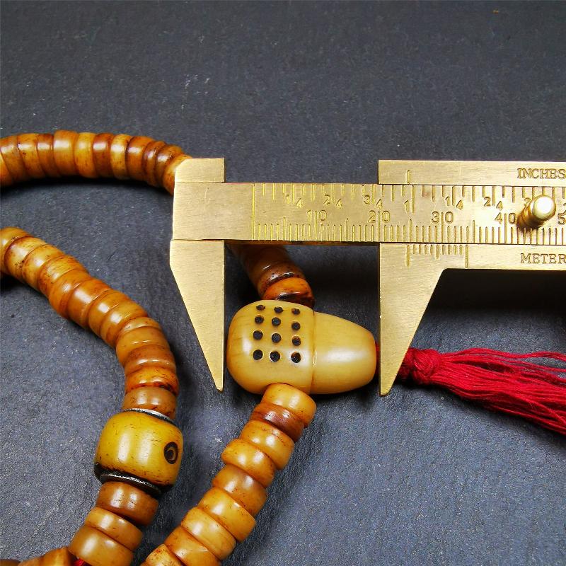 This yak bone mala was handmade from tibetan crafts man in Baiyu County,about 30 years old. It's composed of 108 pcs 9mm bone beads,with bone carved beads,guru bead.