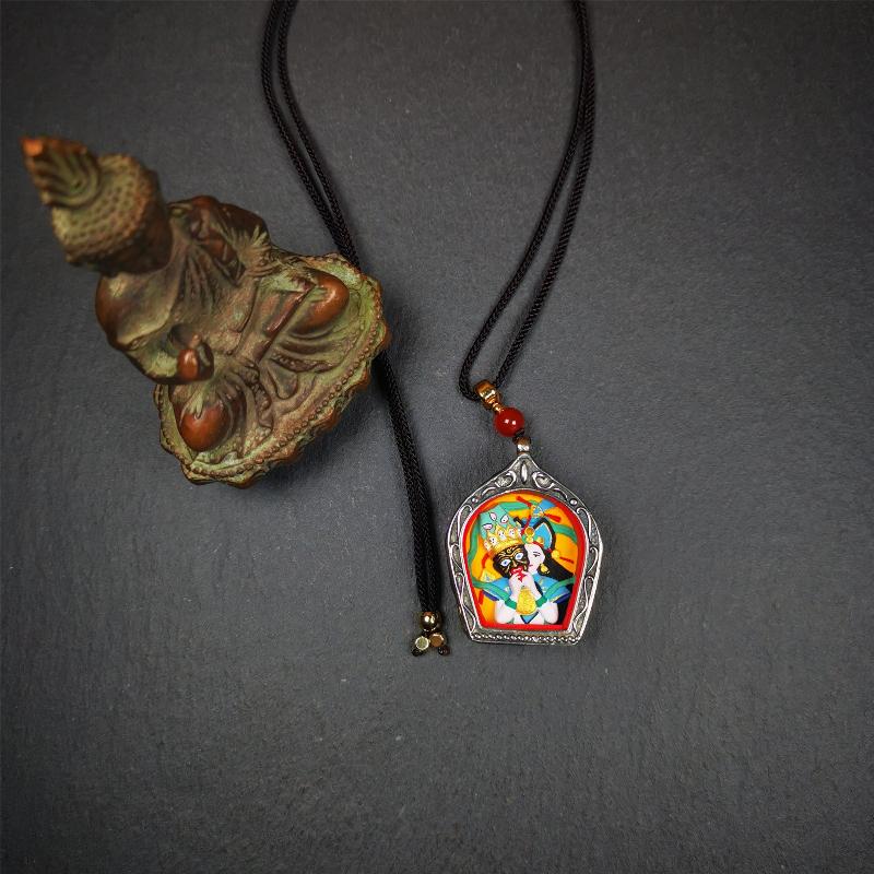 This Drashi Lhamo Gau box is made by Tibetan craftsmen in Hepo Township, Baiyu County,filled in a unique fashion Drashi Lhamo Tsa Tsa - Tibetan girl wearing her mask,made of pottery clay,hand painted.