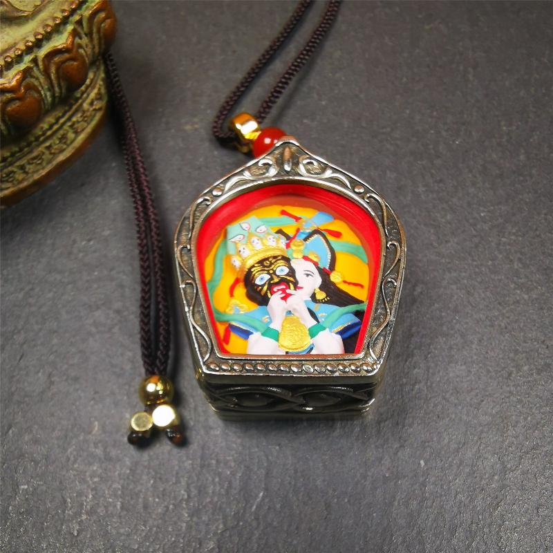 This Drashi Lhamo Gau box is made by Tibetan craftsmen in Hepo Township, Baiyu County,filled in a unique fashion Drashi Lhamo Tsa Tsa - Tibetan girl wearing her mask,made of pottery clay,hand painted.