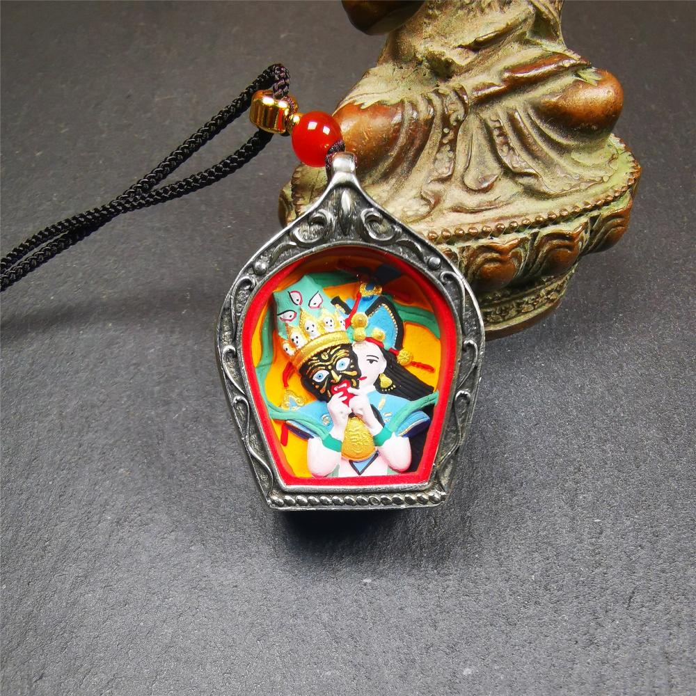 This Drashi Lhamo Gau box is made by Tibetan craftsmen in Hepo Township, Baiyu County,filled in a unique fashion Drashi Lhamo Tsa Tsa - Tibetan girl wearing her mask,made of pottery clay,hand painted.