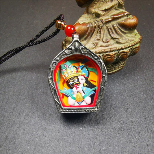 This Drashi Lhamo Gau box is made by Tibetan craftsmen in Hepo Township, Baiyu County,filled in a unique fashion Drashi Lhamo Tsa Tsa - Tibetan girl wearing her mask,made of pottery clay,hand painted.