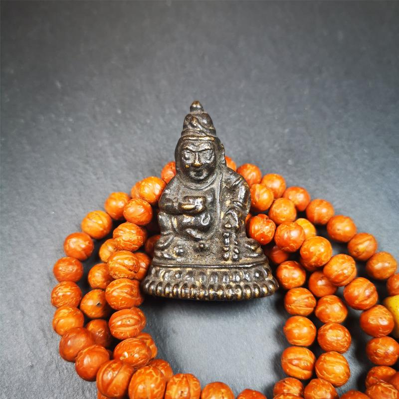 This Yellow Jambhala(Dzambhala) statue was collected from Goinqên goinba Monastery,Dege Tibet,handmade thokcha pendant 80 years ago. It's made of brass,brown color,1.97 inches height and 1.38 inches width.