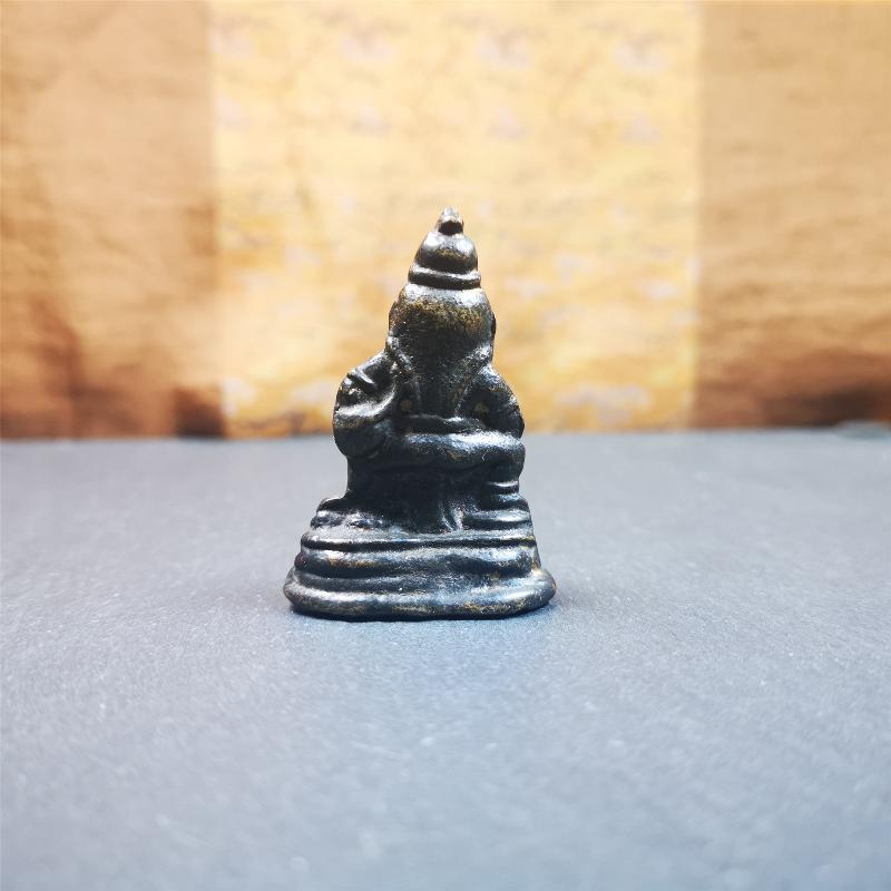 This Yellow Jambhala(Dzambhala) statue was collected from Goinqên goinba Monastery,Dege Tibet,handmade thokcha pendant 80 years ago. It's made of brass,brown color,1.97 inches height and 1.38 inches width.