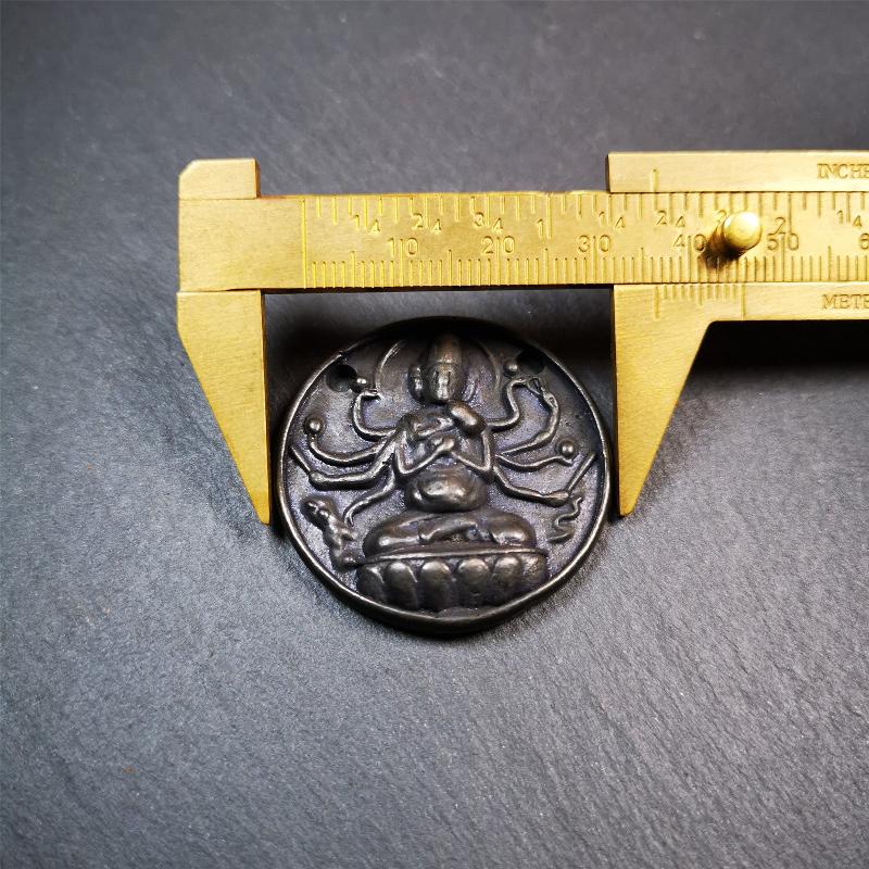 This Usnisa Vijaya statue was collected from Derge,Tibet. It's a badge or pendant,made of copper,brown color, 1.4 inch diameter. You can make it into a necklace,or bag hanging,or just put into your shrine.