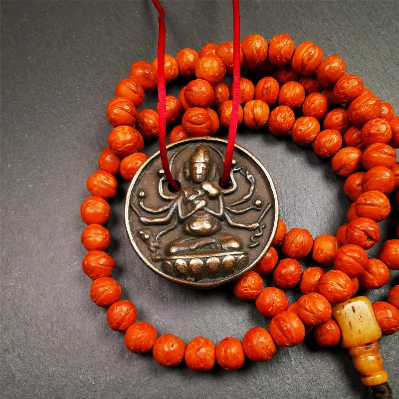 This Usnisa Vijaya statue was collected from Derge,Tibet. It's a badge or pendant,made of copper,brown color, 1.4 inch diameter. You can make it into a necklace,or bag hanging,or just put into your shrine.