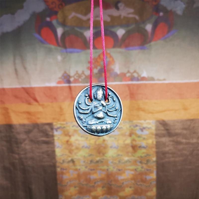 This Usnisa Vijaya statue was collected from Derge,Tibet. It's a badge or pendant,made of copper,brown color, 1.4 inch diameter. You can make it into a necklace,or bag hanging,or just put into your shrine.