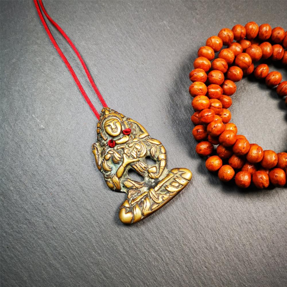 This Vajrasattva statue was collected from Derge,Tibet. It's a badge or pendant,made of copper,brown color, size is 2.24" × 1.57". You can make it into a necklace,or bag hanging