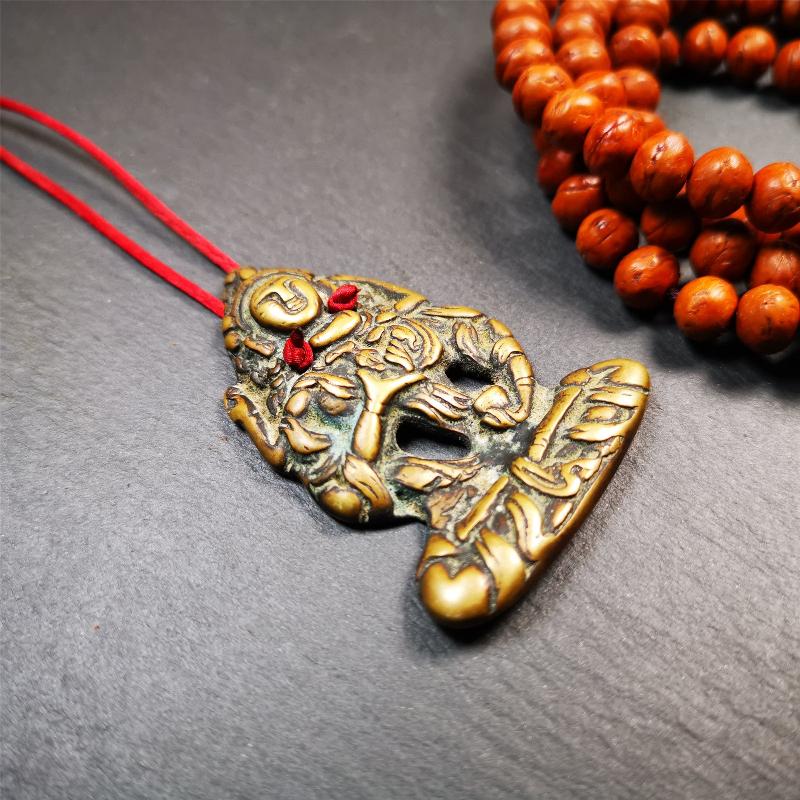 This Vajrasattva statue was collected from Derge,Tibet. It's a badge or pendant,made of copper,brown color, size is 2.24" × 1.57". You can make it into a necklace,or bag hanging