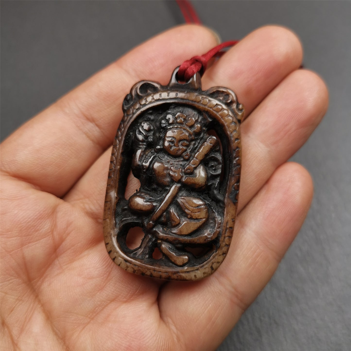 This Troma Nagmo amulet was collected from Gerze Tibet, hand carved by Tibetan Craft man. It is made of yak bone,brown color,size is 2.16" × 1.3". You can make it necklace,or just put into your shrine. Troma Nagmo literally means the Black Wrathful Lady. She is included in the Dharmapala pantheon as a form of Vajravarahi. She is also the feminine embodiment of w