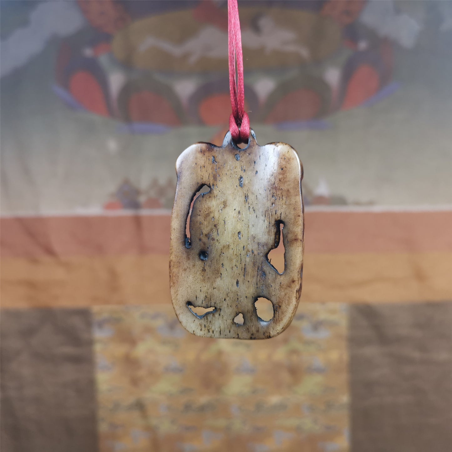 This Troma Nagmo amulet was collected from Gerze Tibet, hand carved by Tibetan Craft man. It is made of yak bone,brown color,size is 2.16" × 1.3". You can make it necklace,or just put into your shrine. Troma Nagmo literally means the Black Wrathful Lady. She is included in the Dharmapala pantheon as a form of Vajravarahi. She is also the feminine embodiment of w