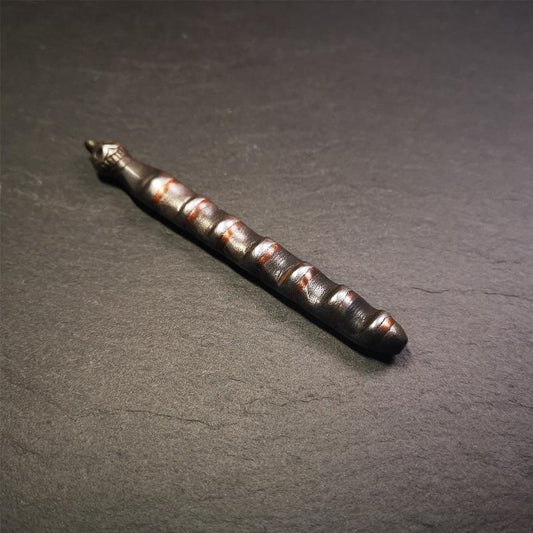 This unique Ladder pendant is made by Tibetan craftsmen in Hepo Township, Baiyu County. It is made of cold iron and copper, black color,the shape is Tibetan Ladder of Heaven,a skull on the top,length is 11cm / 4.33 inches.  The ladder of heaven represents that Tibetans can pass their wishes and blessings to their relatives in the sky, and reach the Paradise of Paradise or the Pure Land of Buddhism as soon as possible.