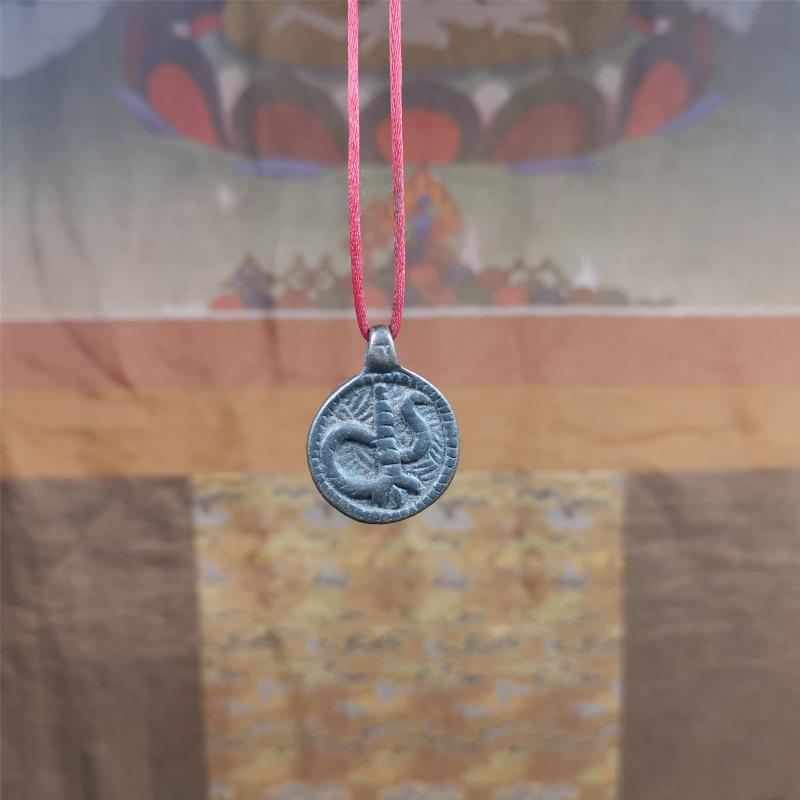 These amulet were handmade by Tibetan craftsmen from Tibet in 1990's. It's made of copper/brass,brown/yellow color,diameter is 0.83 inch,comes with a leather cord. You can make it into a necklace,or bag hanging