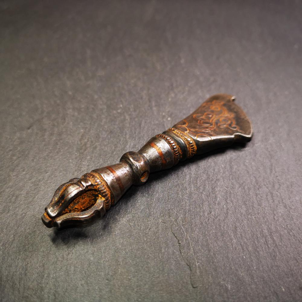 This old kartika is handmade by Tibetan craftsmen in 2000s. Its upper part is a half vajra, and the lower part is a kartika, made of cold iron,copper wire inlaid, carved cloud pattern