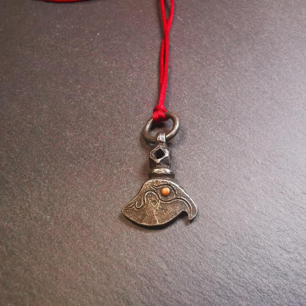 This kartika amulet was made by Tibetan craftsmen in Hepo Township, Baiyu County, the birthplace of the famous Tibetan handicrafts. It's made of cold iron, inlaid copper,carved with could pattern,size is 1.1 × 0.8 inches. You can make it into a necklace, or a keychain, or just put it on your desk,as an ornament.