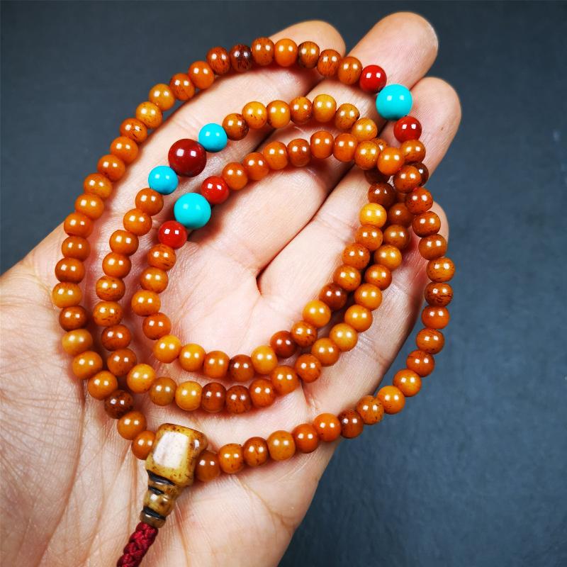 This yak bone mala was handmade from tibetan crafts man in Baiyu County,about 30 years old. It's composed of 108 pcs small size 6mm bone beads,with agate and turquoise beads,bone guru bead.Circumference about 61cm,24 inches.