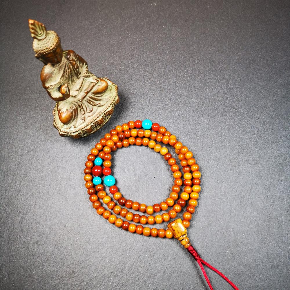 This yak bone mala was handmade from tibetan crafts man in Baiyu County,about 30 years old. It's composed of 108 pcs small size 6mm bone beads,with agate and turquoise beads,bone guru bead.Circumference about 61cm,24 inches.