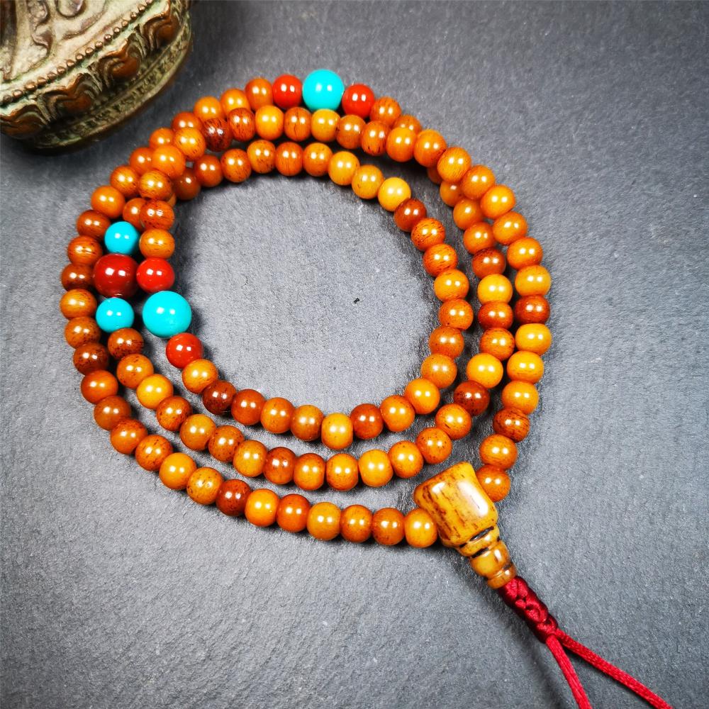 This yak bone mala was handmade from tibetan crafts man in Baiyu County,about 30 years old. It's composed of 108 pcs small size 6mm bone beads,with agate and turquoise beads,bone guru bead.Circumference about 61cm,24 inches.