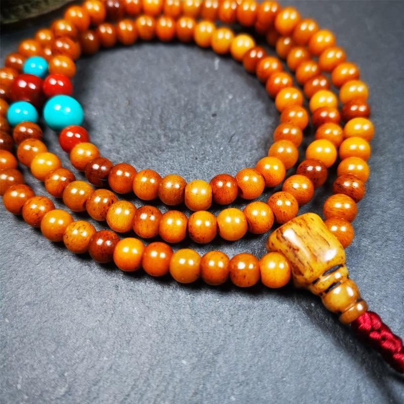 This yak bone mala was handmade from tibetan crafts man in Baiyu County,about 30 years old. It's composed of 108 pcs small size 6mm bone beads,with agate and turquoise beads,bone guru bead.Circumference about 61cm,24 inches.