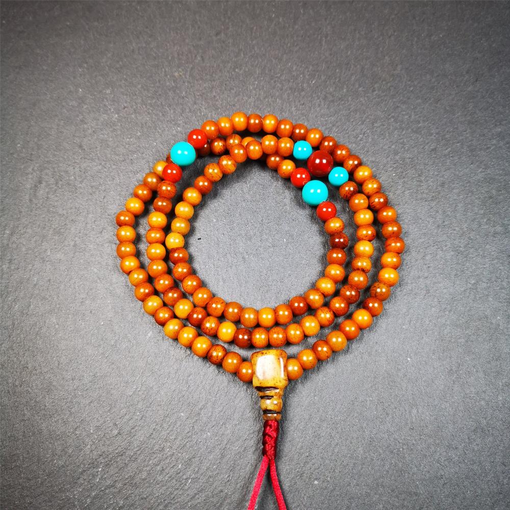 This yak bone mala was handmade from tibetan crafts man in Baiyu County,about 30 years old. It's composed of 108 pcs small size 6mm bone beads,with agate and turquoise beads,bone guru bead.Circumference about 61cm,24 inches.