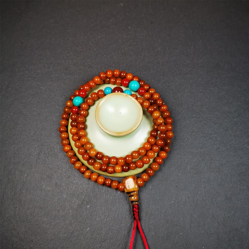 This yak bone mala was handmade from tibetan crafts man in Baiyu County,about 30 years old. It's composed of 108 pcs small size 6mm bone beads,with agate and turquoise beads,bone guru bead.Circumference about 61cm,24 inches.