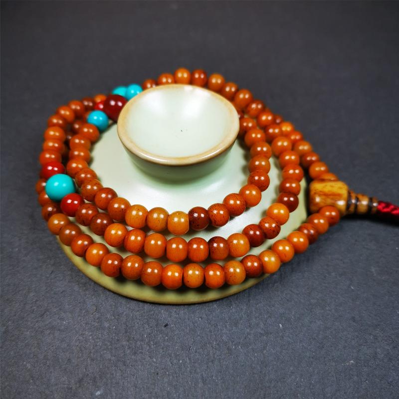 This yak bone mala was handmade from tibetan crafts man in Baiyu County,about 30 years old. It's composed of 108 pcs small size 6mm bone beads,with agate and turquoise beads,bone guru bead.Circumference about 61cm,24 inches.