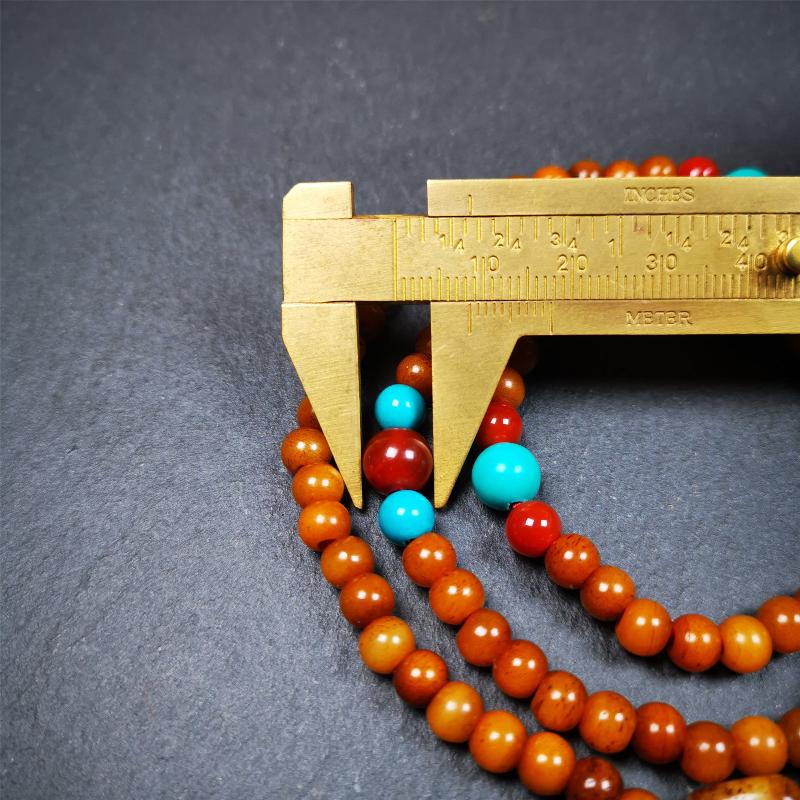 This yak bone mala was handmade from tibetan crafts man in Baiyu County,about 30 years old. It's composed of 108 pcs small size 6mm bone beads,with agate and turquoise beads,bone guru bead.Circumference about 61cm,24 inches.