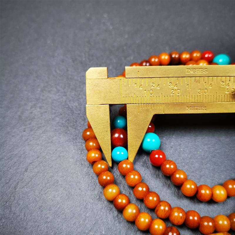 This yak bone mala was handmade from tibetan crafts man in Baiyu County,about 30 years old. It's composed of 108 pcs small size 6mm bone beads,with agate and turquoise beads,bone guru bead.Circumference about 61cm,24 inches.