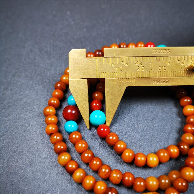 This yak bone mala was handmade from tibetan crafts man in Baiyu County,about 30 years old. It's composed of 108 pcs small size 6mm bone beads,with agate and turquoise beads,bone guru bead.Circumference about 61cm,24 inches.